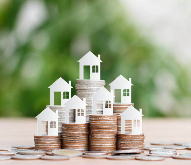 House model on coins stack for saving to buy a house